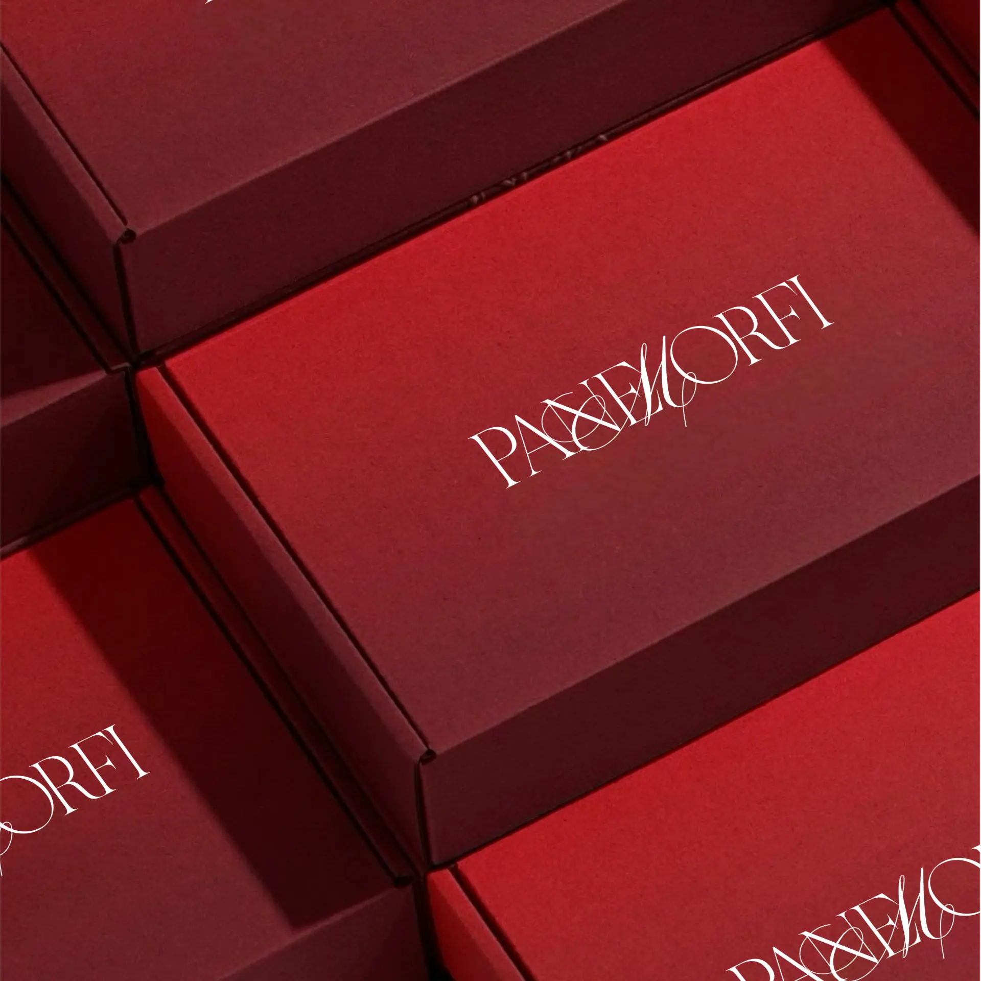 Paxxmorfi branded packaging boxes in deep red